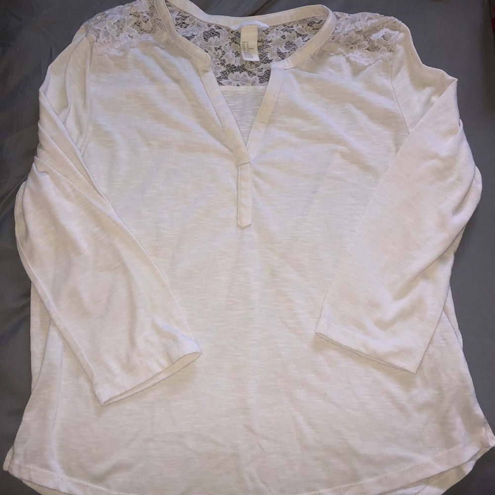 Long white shirt.